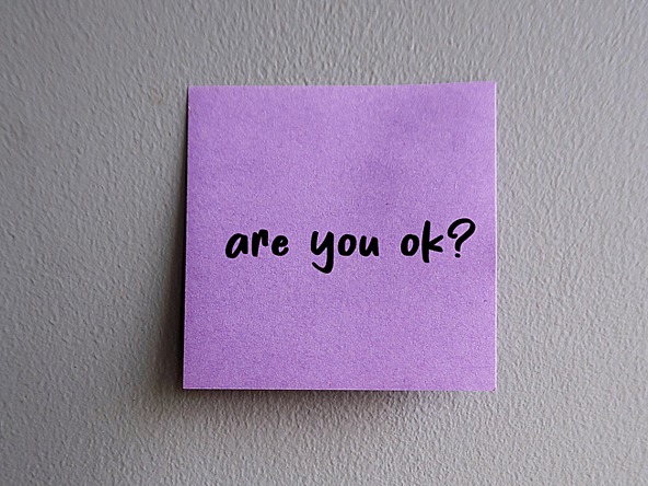 purple post-it note with handwritten message 'are you ok?'
